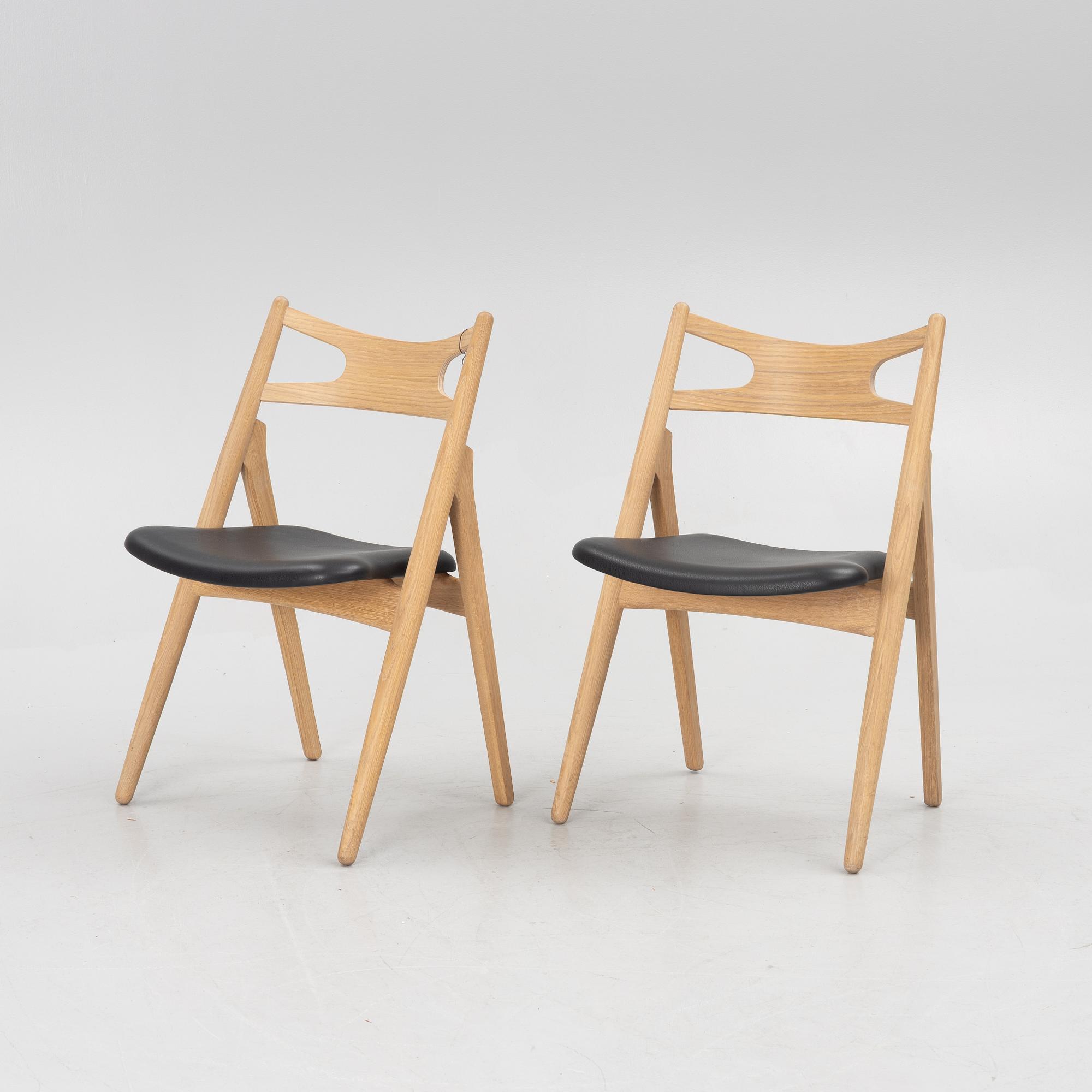 Hans J Wegner, a pair of chairs, model CH 29 "The Savbuk Chair", Carl Hansen.