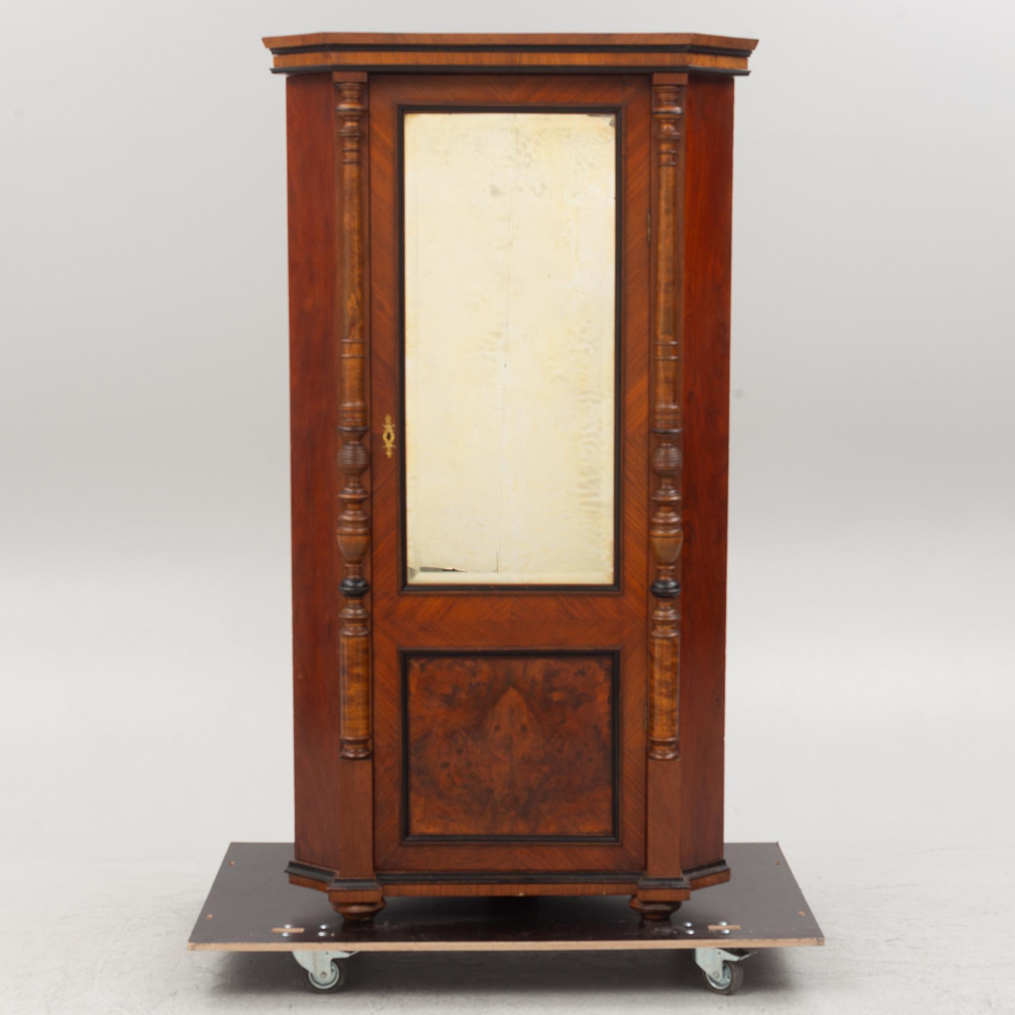 A corner cabinet, circa 1900.