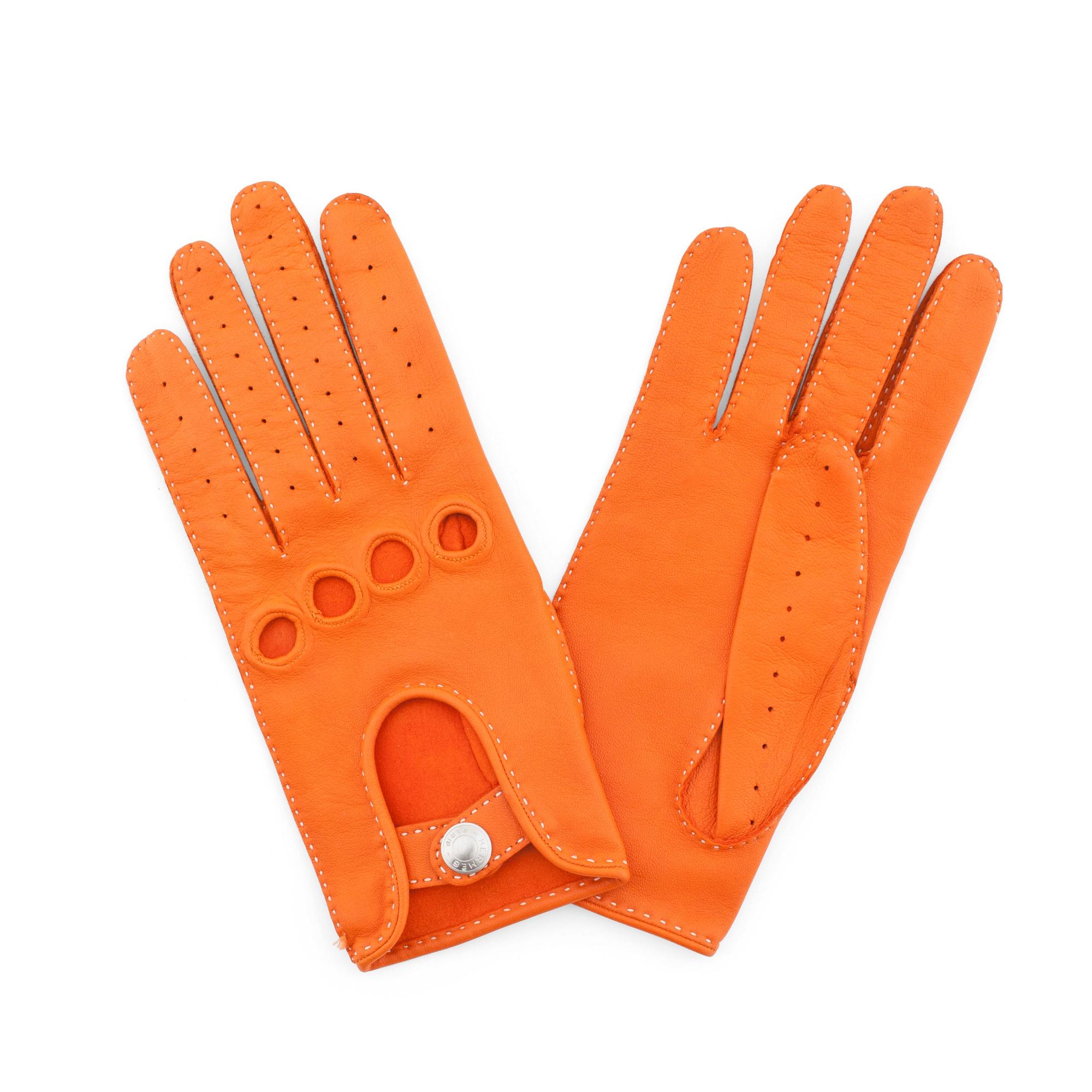 HERMÈS, a pair of orange lambskin leather gloves.