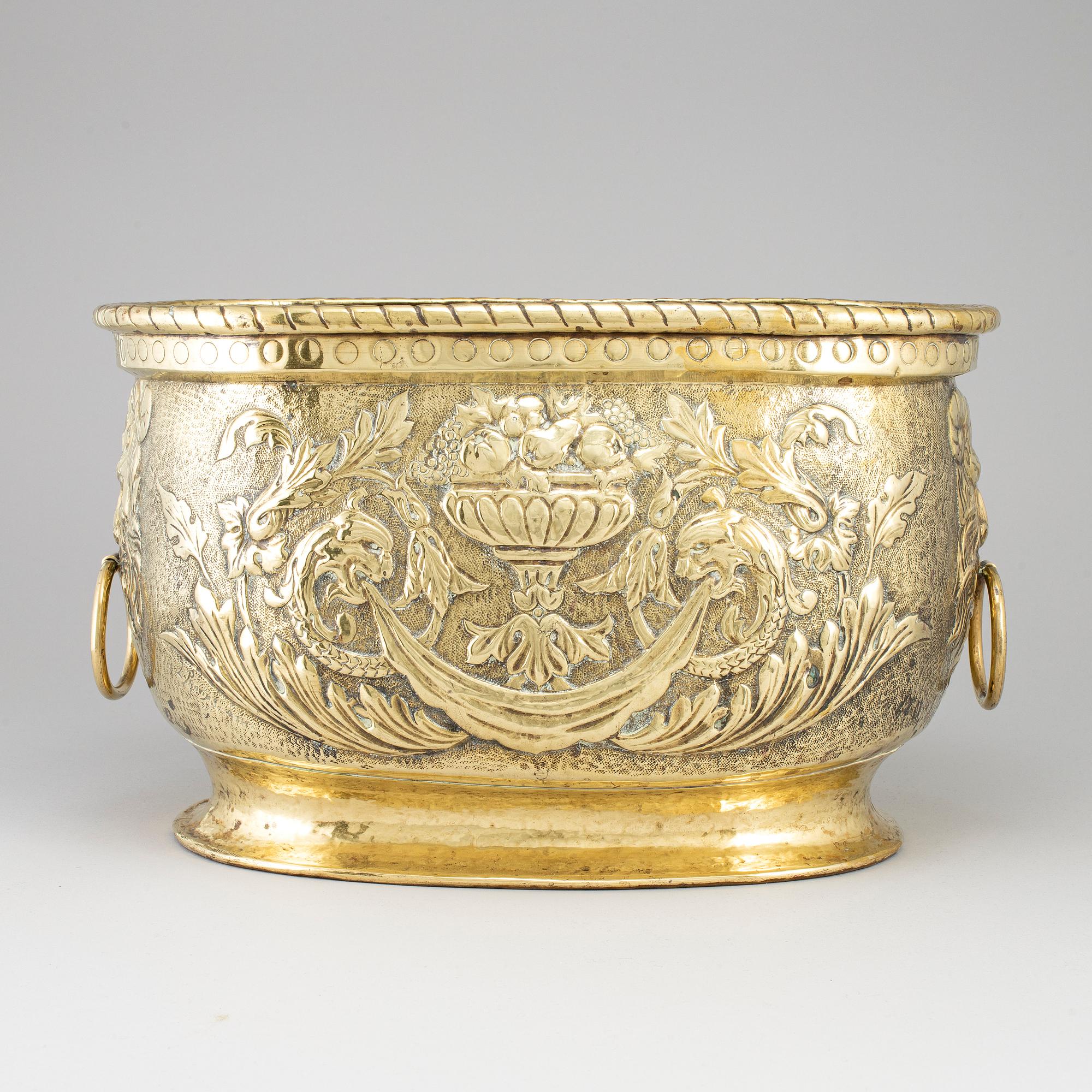 An 18th century brass champagne cooler.