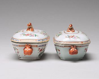 A pair of famille rose 'double peacock' butter tureens with cover and stand, Qing dynasty, Qianlong (1736-95).