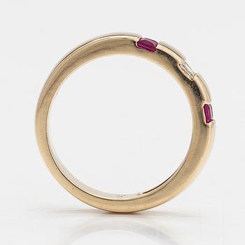 A 14K gold ring with diamonds approx. 0.012 ct in total and rubies.