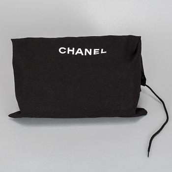 A white Chanel bag, 2010-2011.