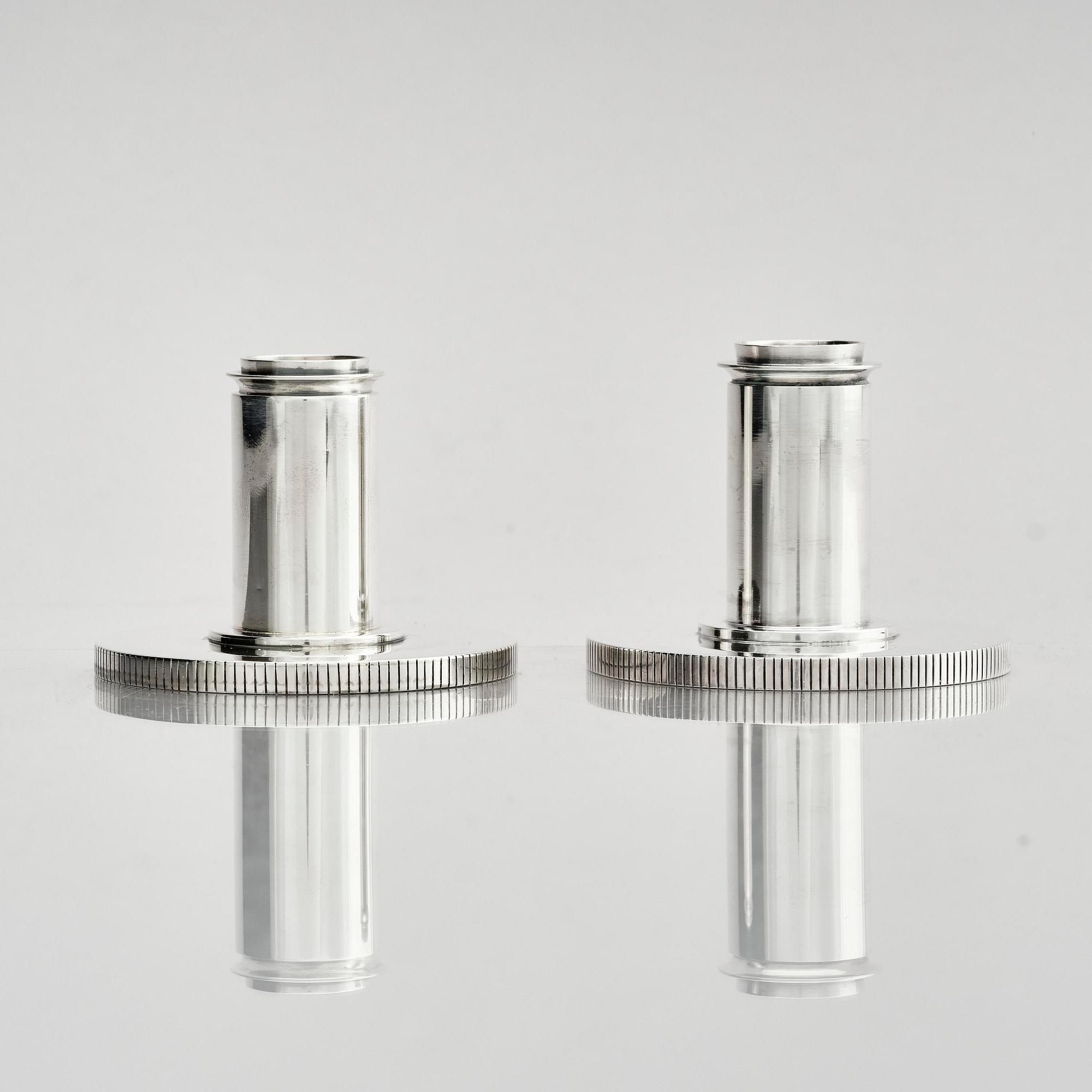 Georg Jensen, a pair of sterling silver candlesticks, design by Sigvard Bernadotte, model no 711A, Copenhagen, Denm after 1945.