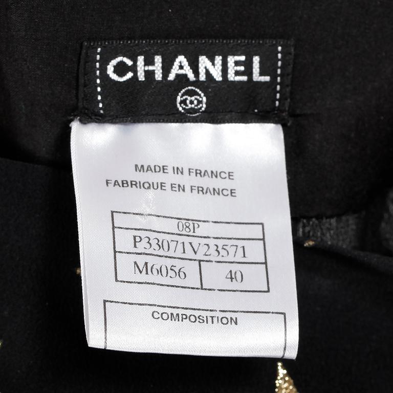 CHANEL, a black silk trouser suit, spring 2008.