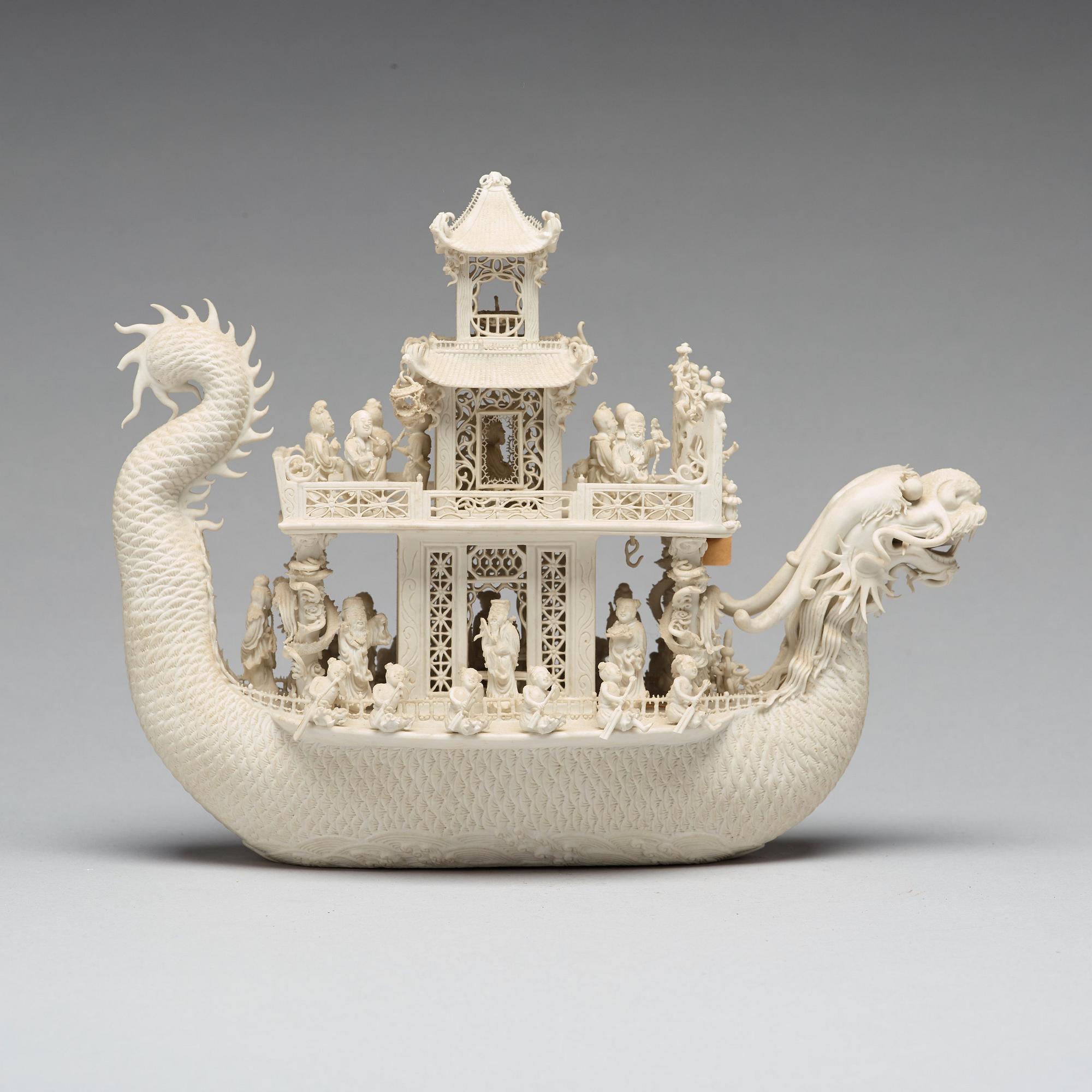A biscuit porcelain dragon boat of 'Assembly of Immortals', Qing dynasty, Daoguang, signed Chen Guozhi, 19th century.