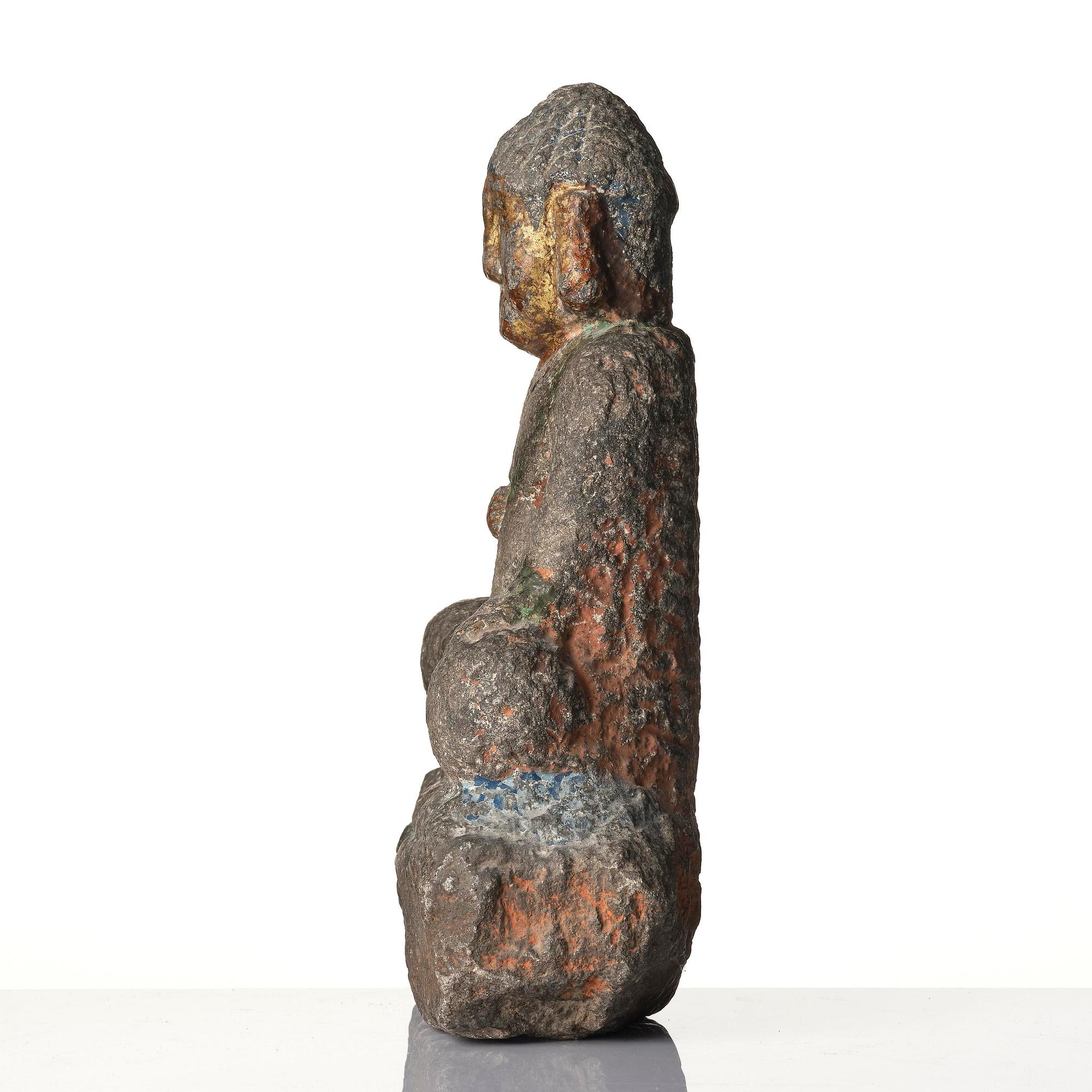 A stone sculpture of Buddha, Ming style.