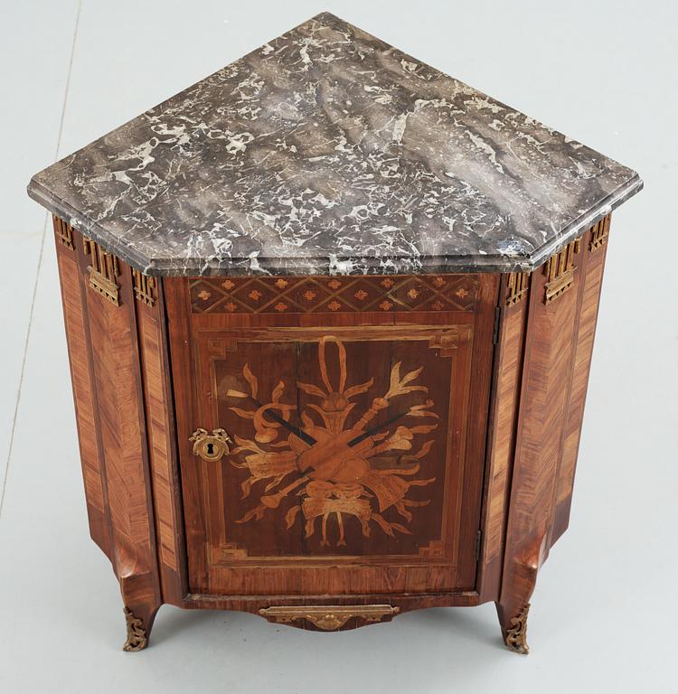 A late 18th Century Louis XVI encoignure stamped by Martin Ohneberg.