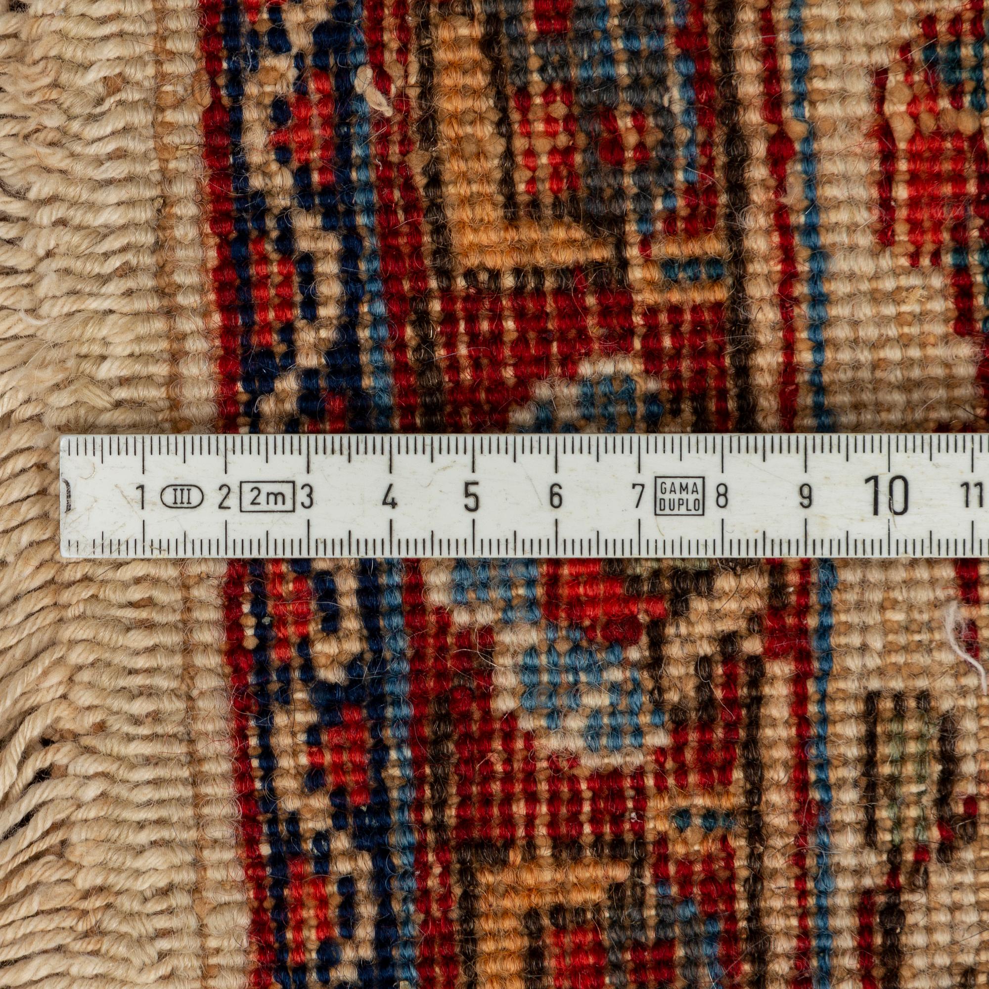 A carpet, semi-antique Tabriz,  342 x 231 cm.
