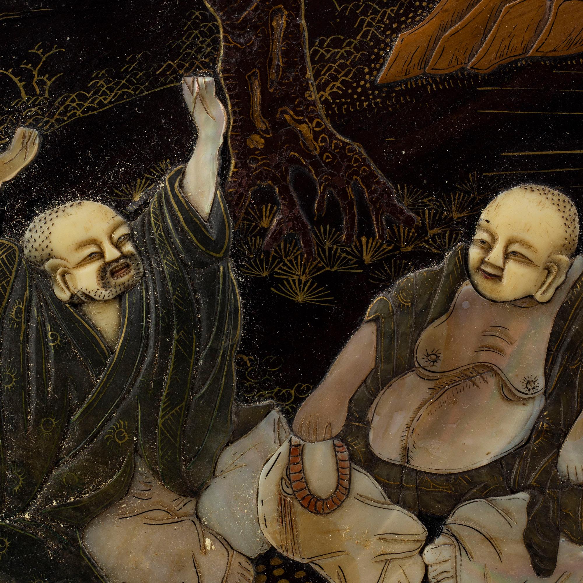 A lacquered panel with stone and mother of pearl inlay, China, circa 1900.