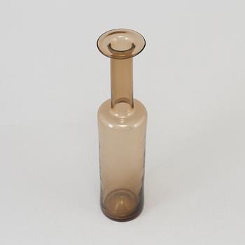 A glass bottle signed Nanny Still Riihimäen Lasi Oy; designed in 1959.