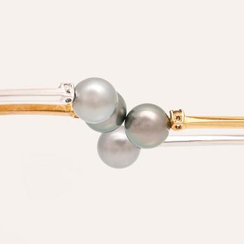 An 18K white- and yellow gold necklace with round brilliant cut diamonds and cultured Tahitian pearls, Damiani Italy.
