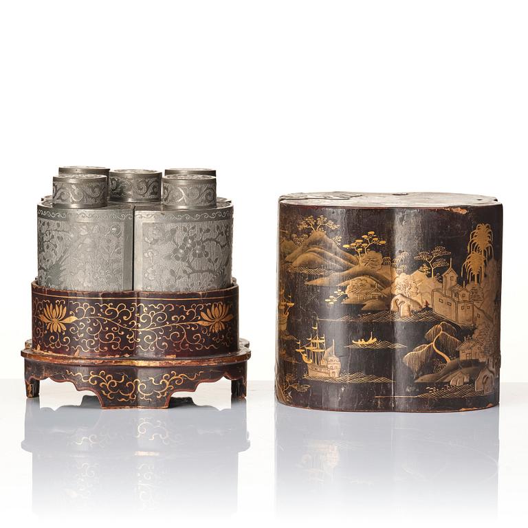 A Chinese lacquer box with a set of five pewter tea caddies, Qing dynasty, 18/19th Century.