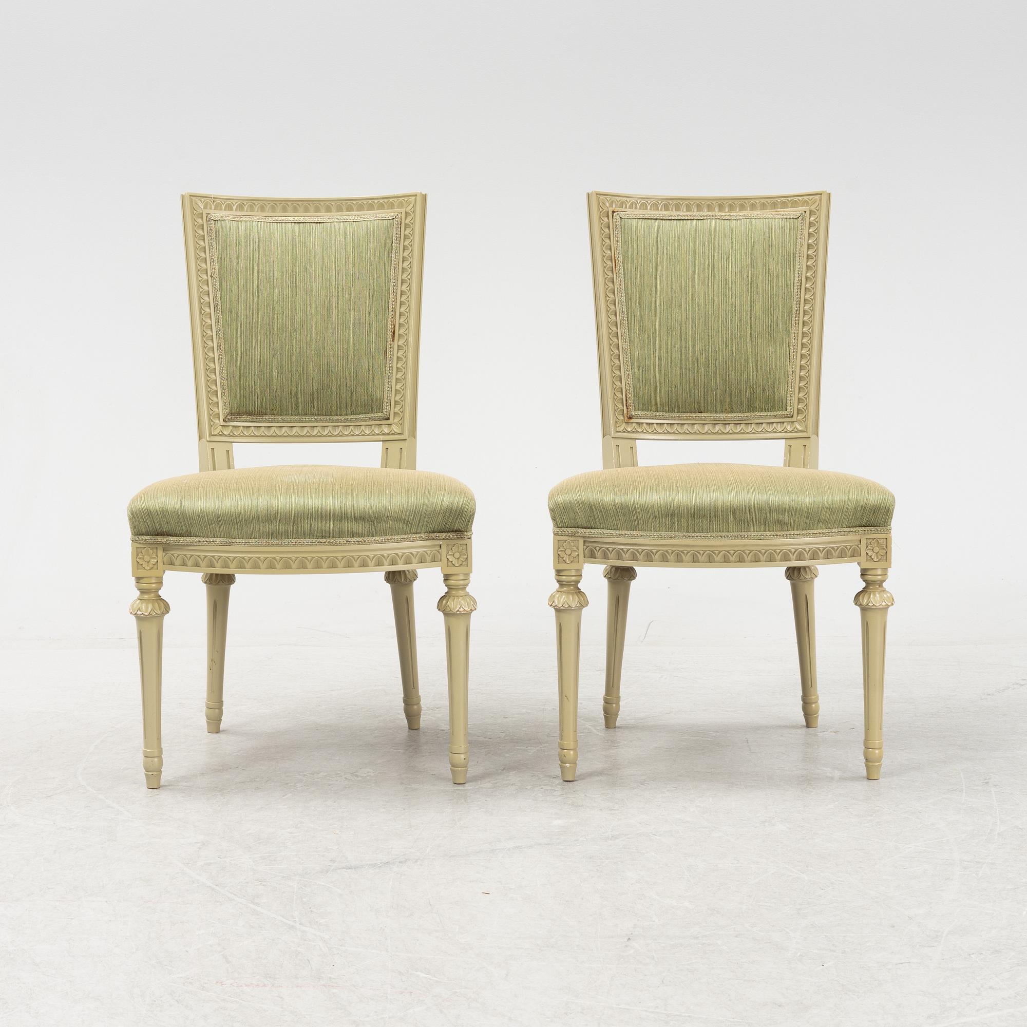 A Gustavian dining table with six chairs. Åmells dated 1974.