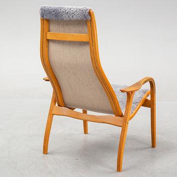 Yngve Ekström, a 'Lamino'  shearling upholstered lounge chair and foot stool from Swedese.