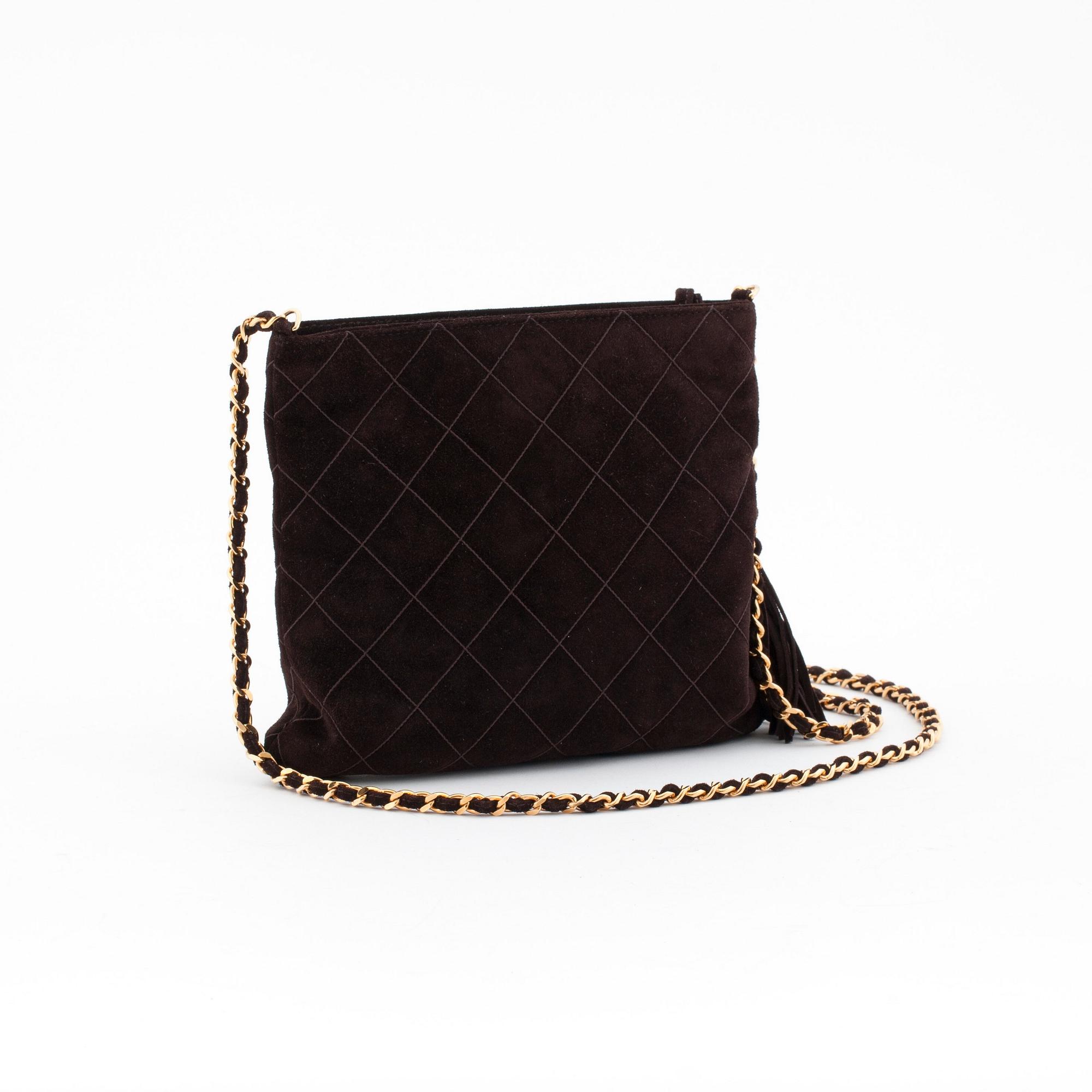 CHANEL, a brown suede cross body bag.