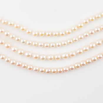 Four rows of cultured pearls, without a clasp.