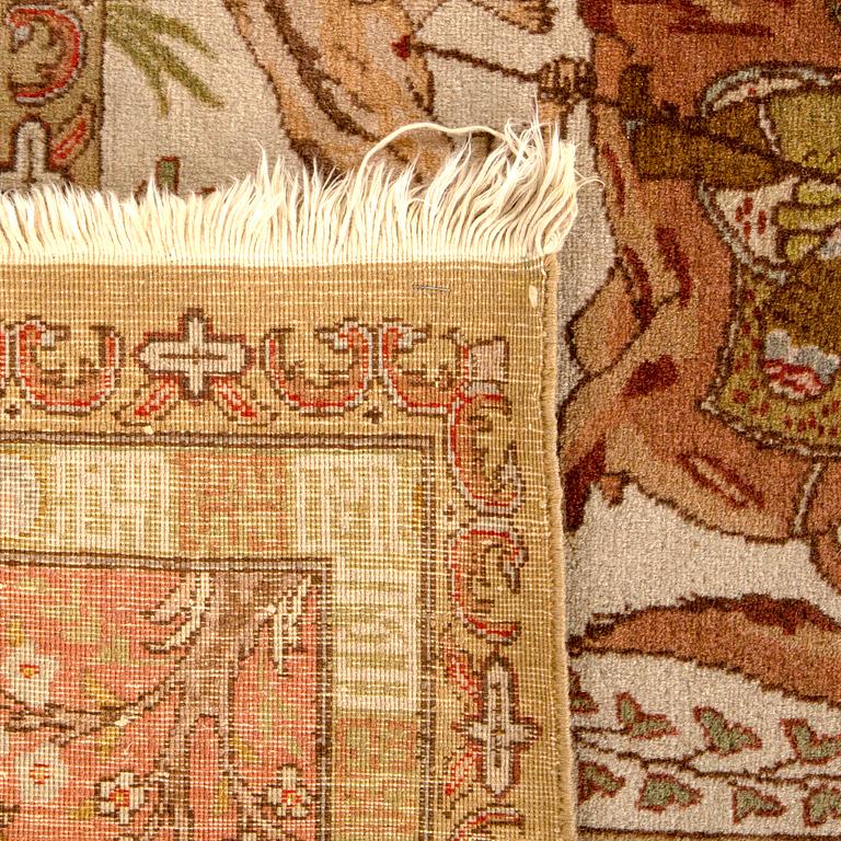 A semiantique Tabriz carpet signed ca 290 x 198 cm.