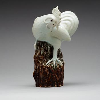 A white glazed figure of a rooster, Qing dynasty (1644-1912).