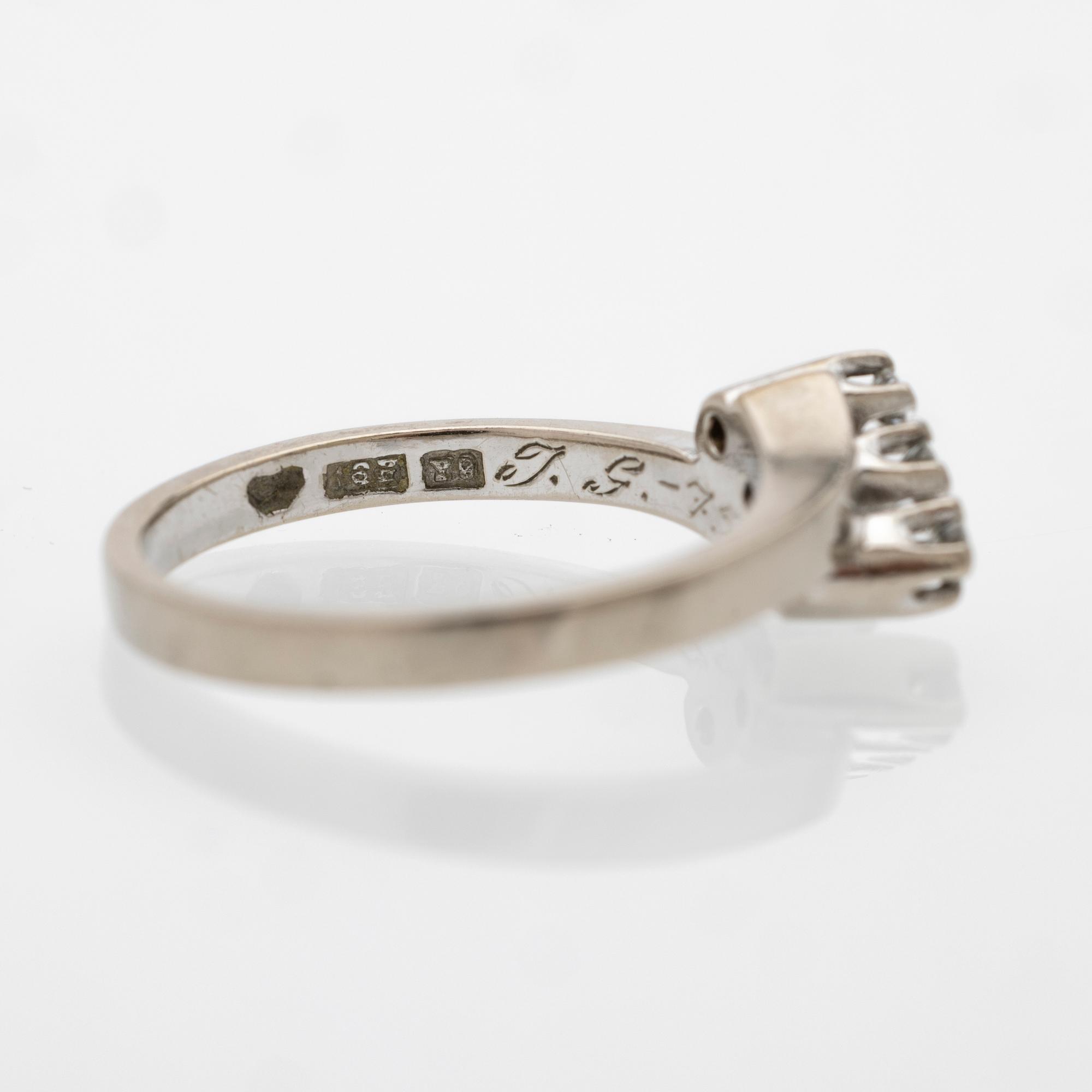18K white gold ring with diamonds.