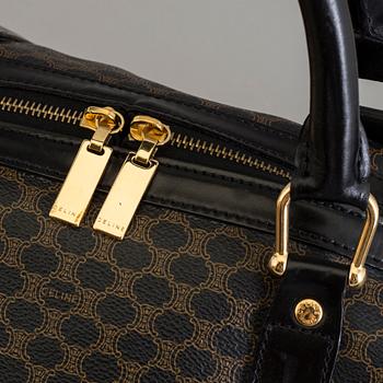 a CÉLINE weekend bag.