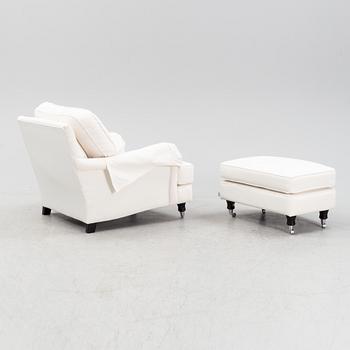 An easy chair with ottoman from Englesson, 21st century.
