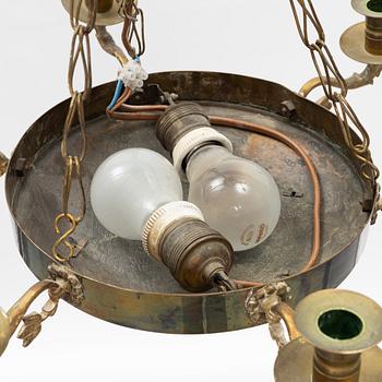 An empire style brass chandelier, around 1900.