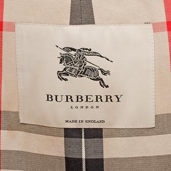 BURBERRY, a black cotton trenchcoat.
