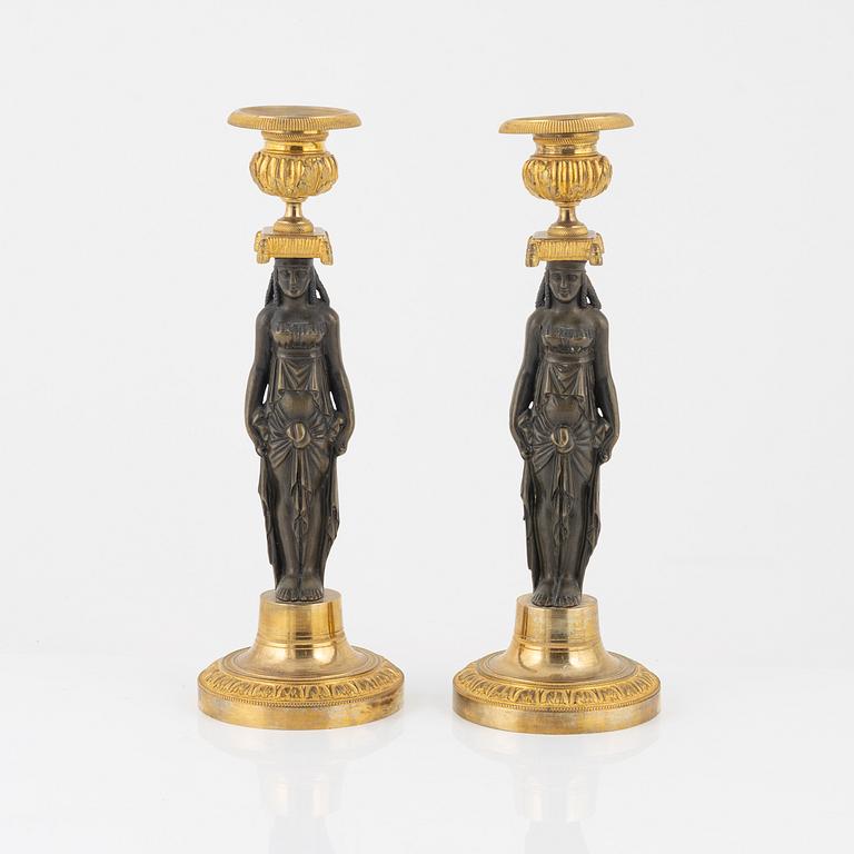 A pair of empire/style candlesticks.