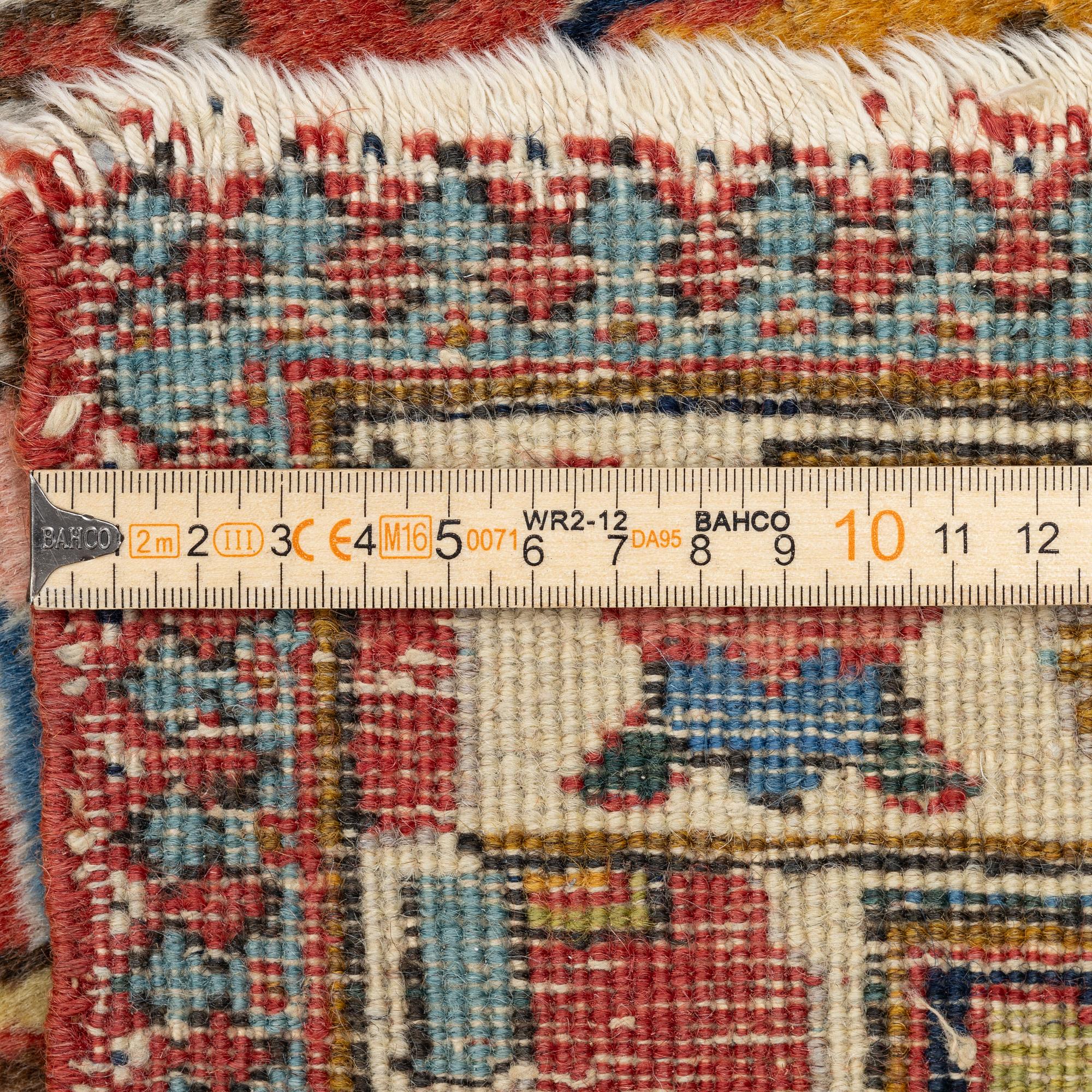 An antique Tabriz carpet, c. 365 x 280 cm.