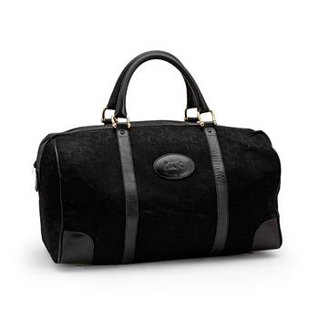 CÉLINE, a black canvas weekendbag.