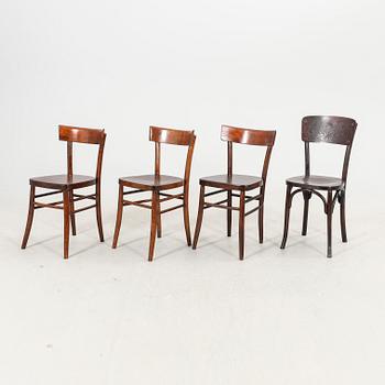 A set of four different early 1900s chairs.