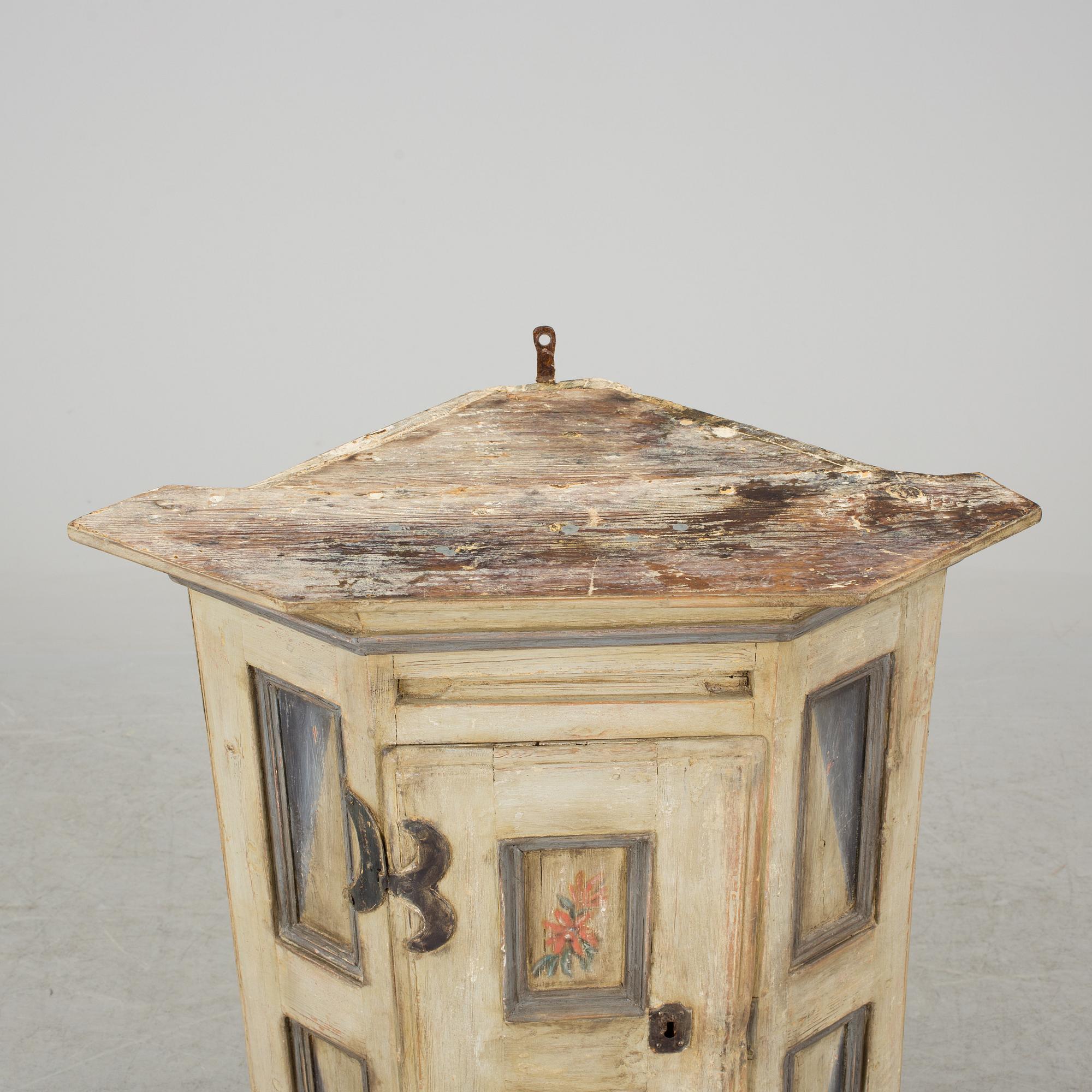 A 18th century corner cabinet.