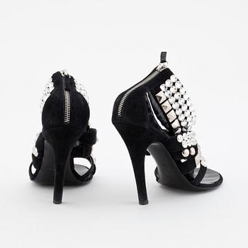BALMAIN, a pair of black suede sandals with decorative embellishment.