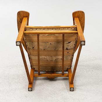 An oak Arts and Crafts armchair, early 20th century.