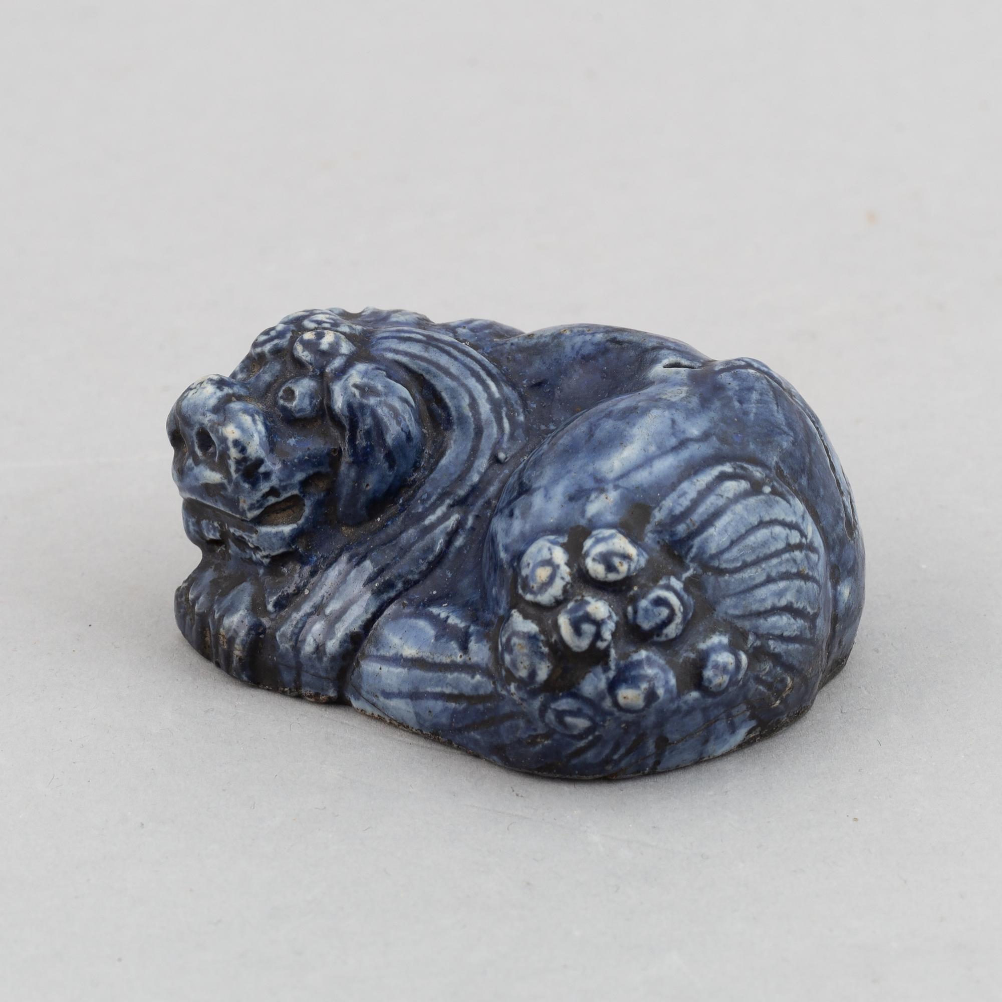 A blue glazed figure of a buddhist lion, Qing dynasty, Qianlong (1736-95).