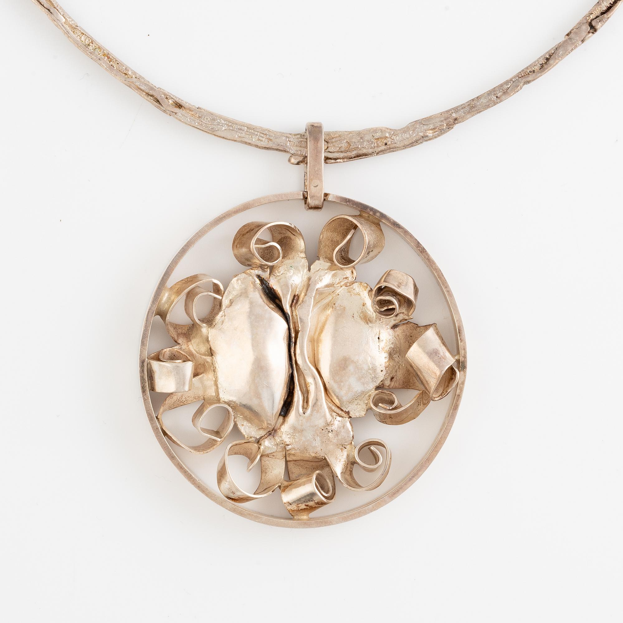 Lars Arby, three neck rings with pendants, silver, Gothenburg including 1977, 1978, and 1982.