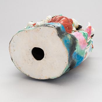 A Chinese porcelain laughing buddha with children, the 20th century.