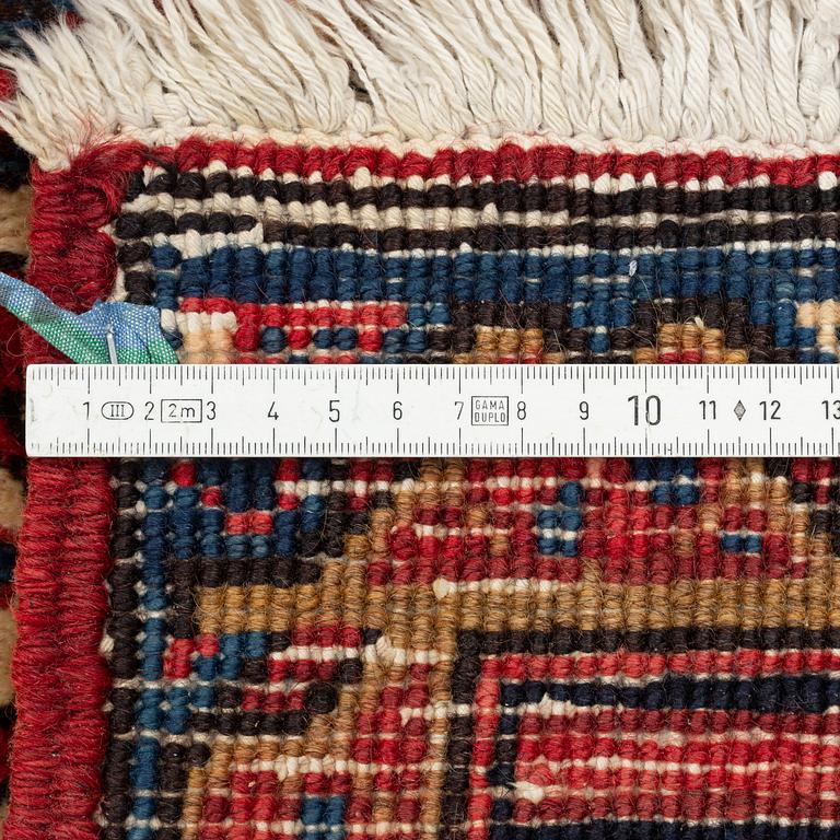 An oriental carpet, c. 330 x 285 cm.