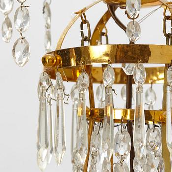 A late Gustavian gilt-brass and cut-glass four-branch chandelier, circa 1800.