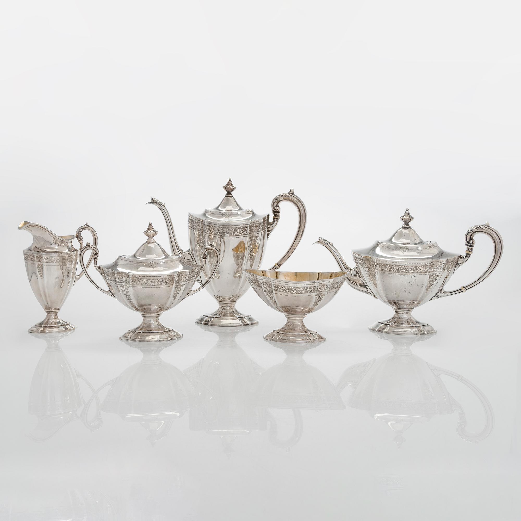 A five-piece sterling silver coffee and tea service, and 12 spoons, USA, first quarter of the 20th century.