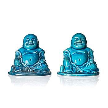 1084. A pair of turquoise glazed joss stick holders in the shape of Buddai, Qing dynasty, 18th Century.