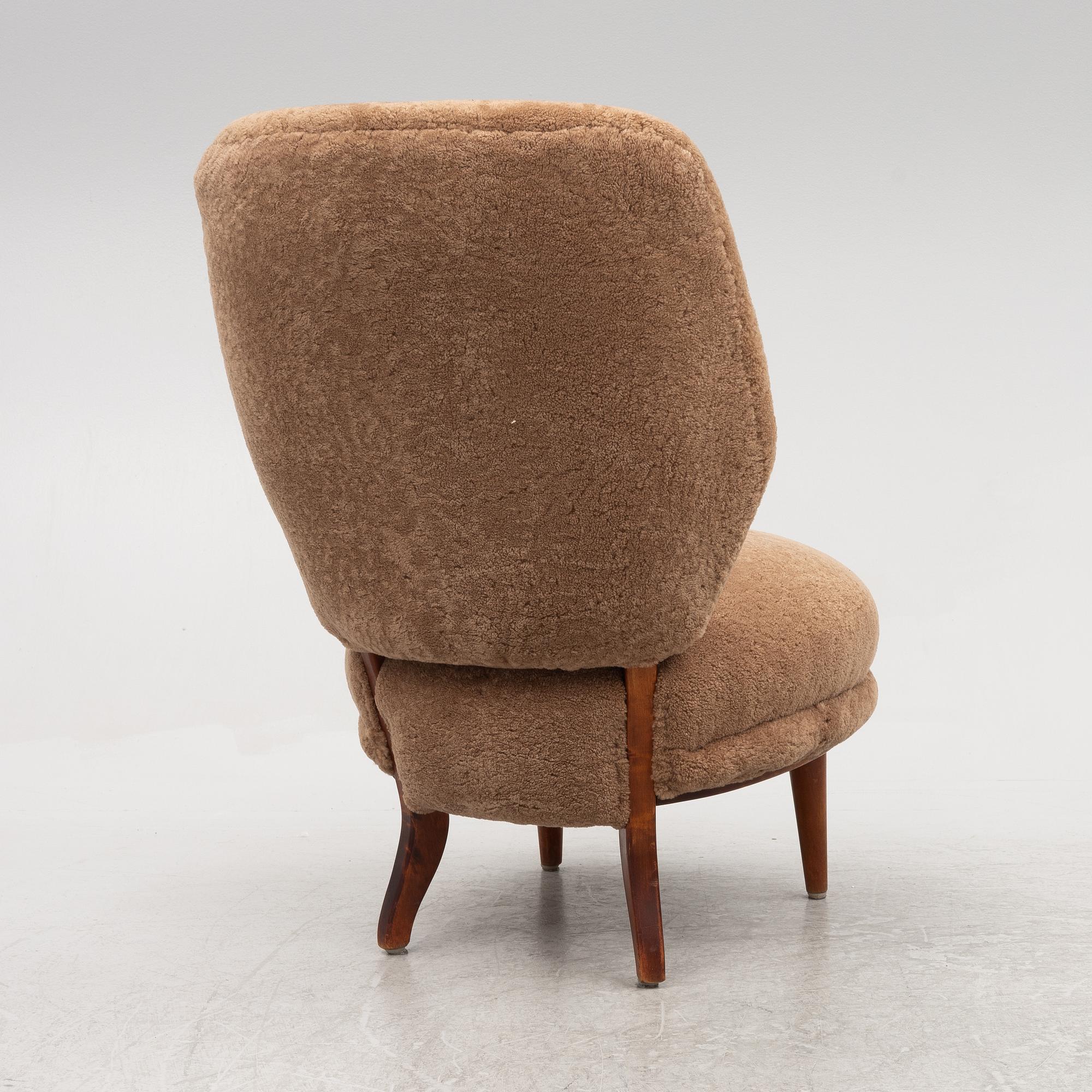 A mid 20th century easy chair,.