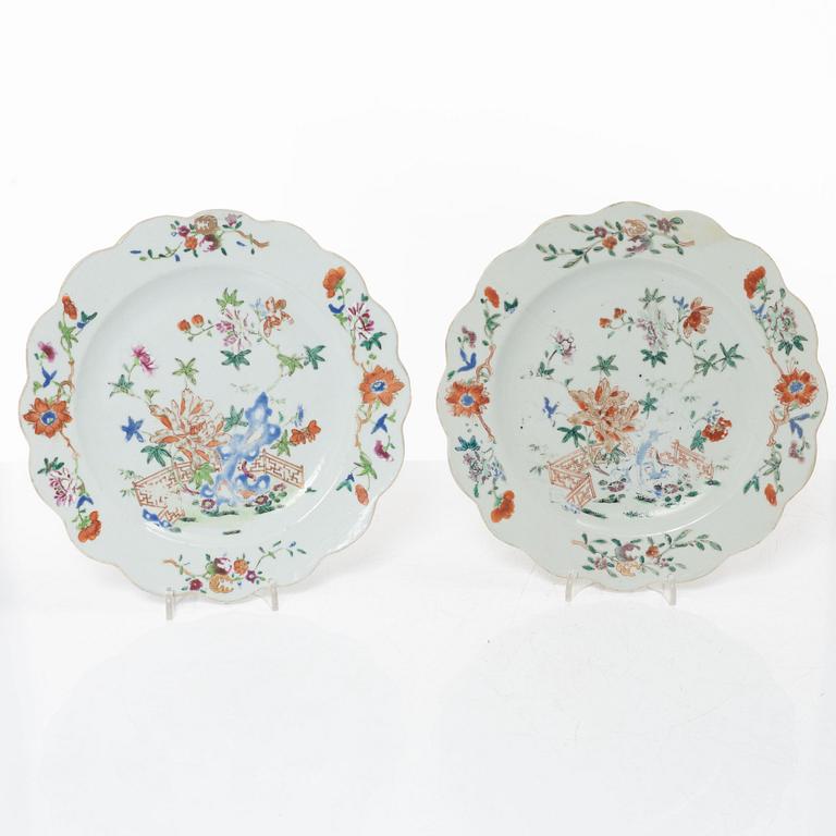 A pair of Chinese famille rose teacups with saucers and a pair of plates and two dishes, Qing dynasty, 18th century.