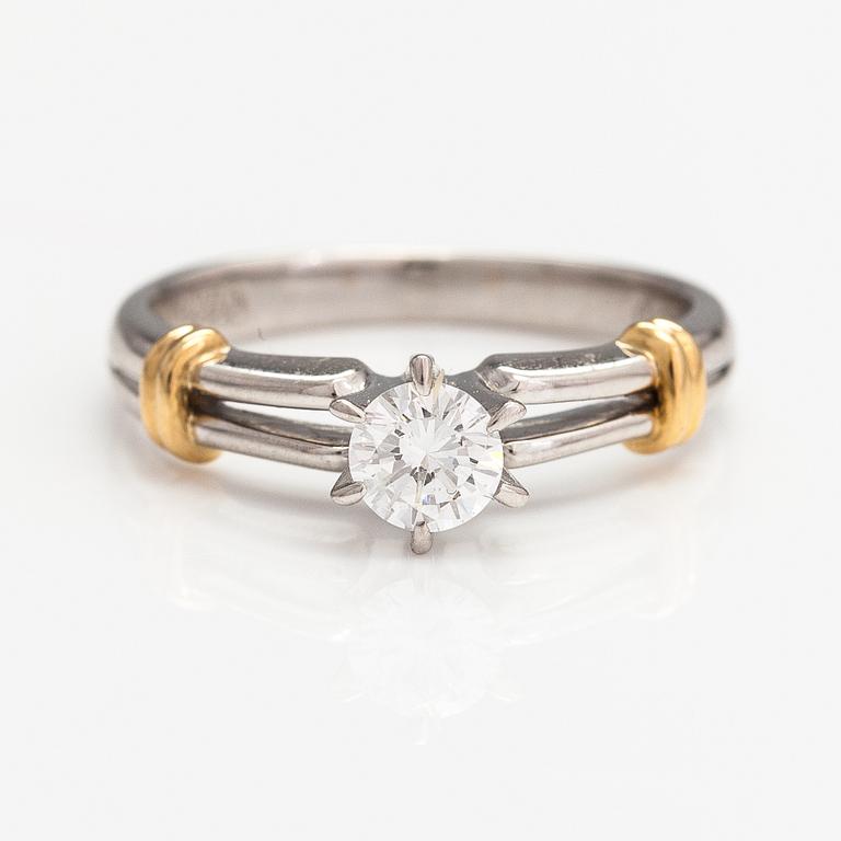 Dior, An 18K gold and platinum ring with a ca. 0.271 ct diamond. Marked CH Dior, 542.