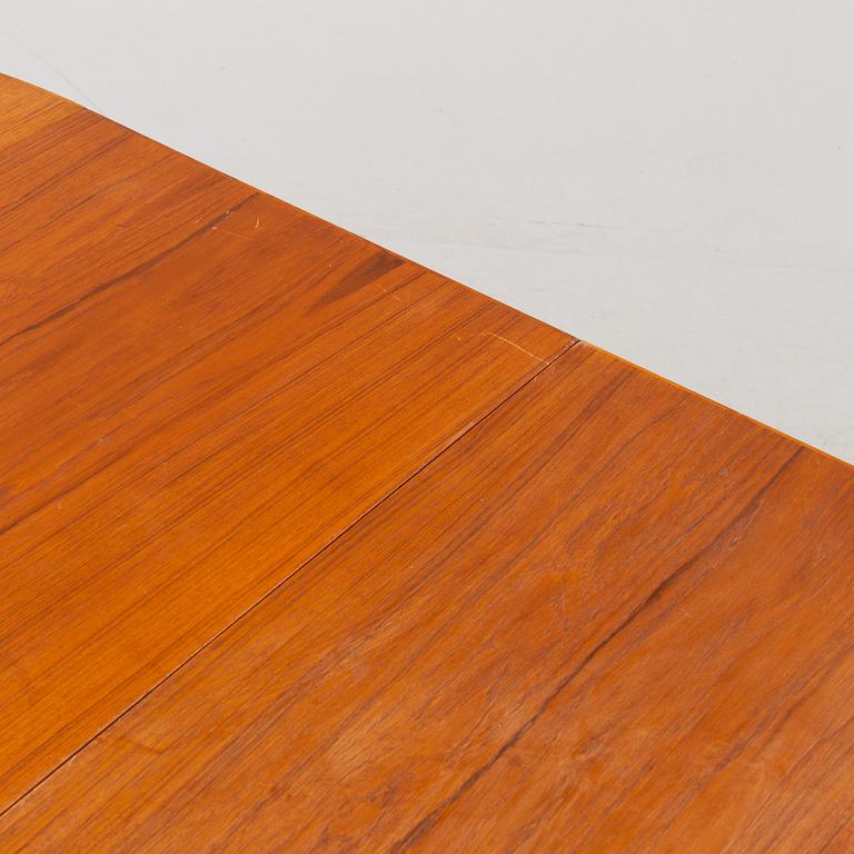A 1950's/60's teak-veneered dining table.