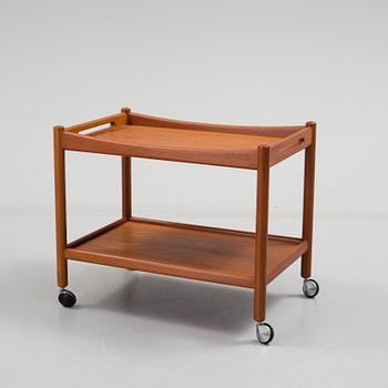 A Hans J Wegner serving trolley veneered with teak.