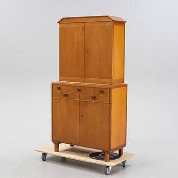 Carl Malmsten, a 'Mittens Rike' mahogany veneered cabinet, Åfors Möbelfabrik, Blomstermåla, dated 1957.
