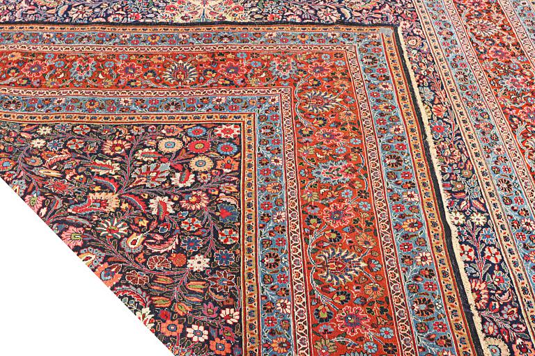 A semi-antique Meshad carpet, a. 360 x 252 cm.