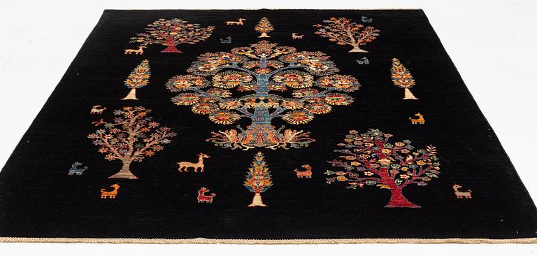 A figural oriental Carpet, circa 263 x 201 cm.